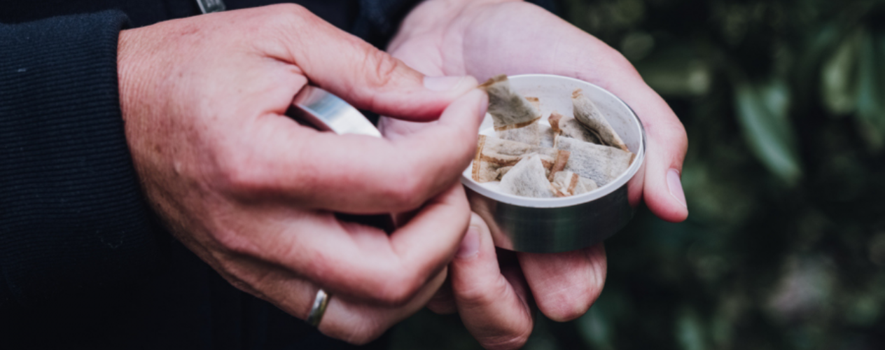 Close-up of hands holding smokeless tobacco