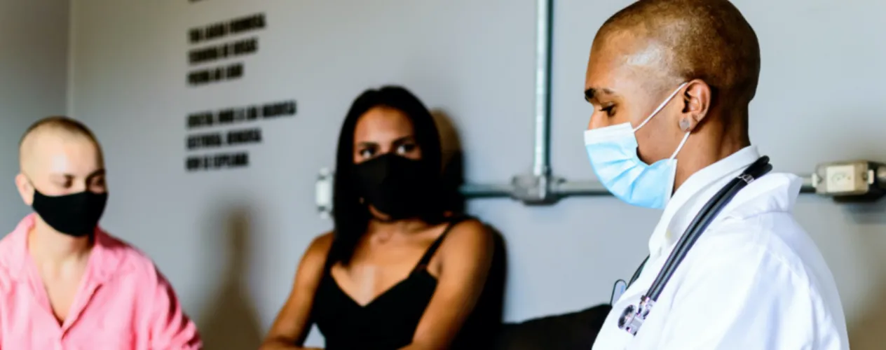 Doctor discussing with two patients