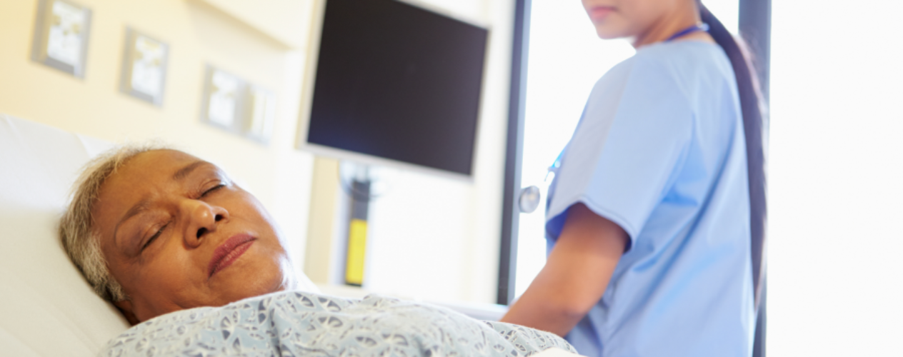 Nurse watching over sleeping patient