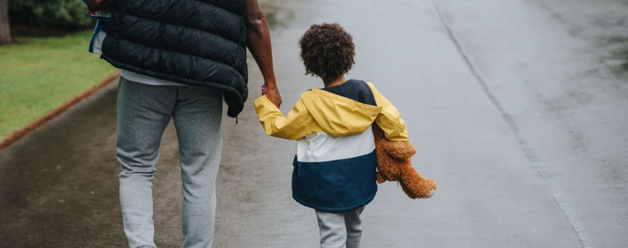 Child holding parent's hand