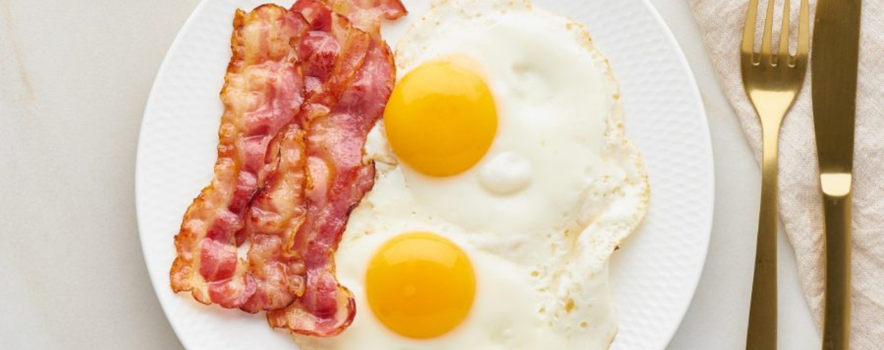 Plate of bacon and fried eggs