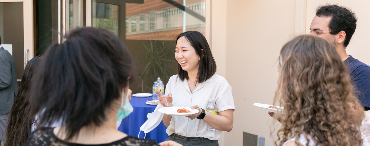 Group of students laughing and talking