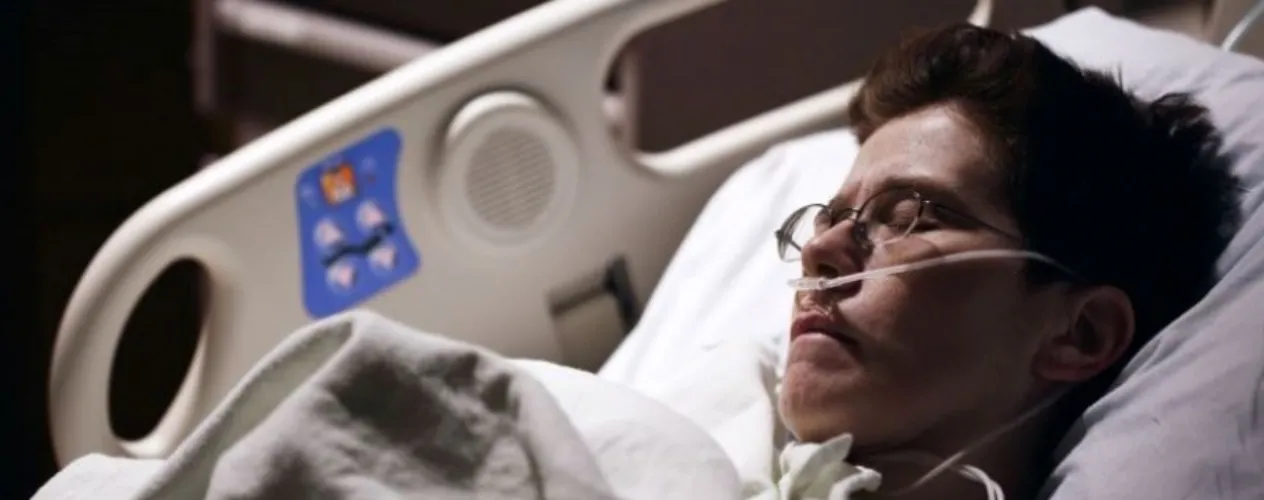 Patient sleeping in hospital bed