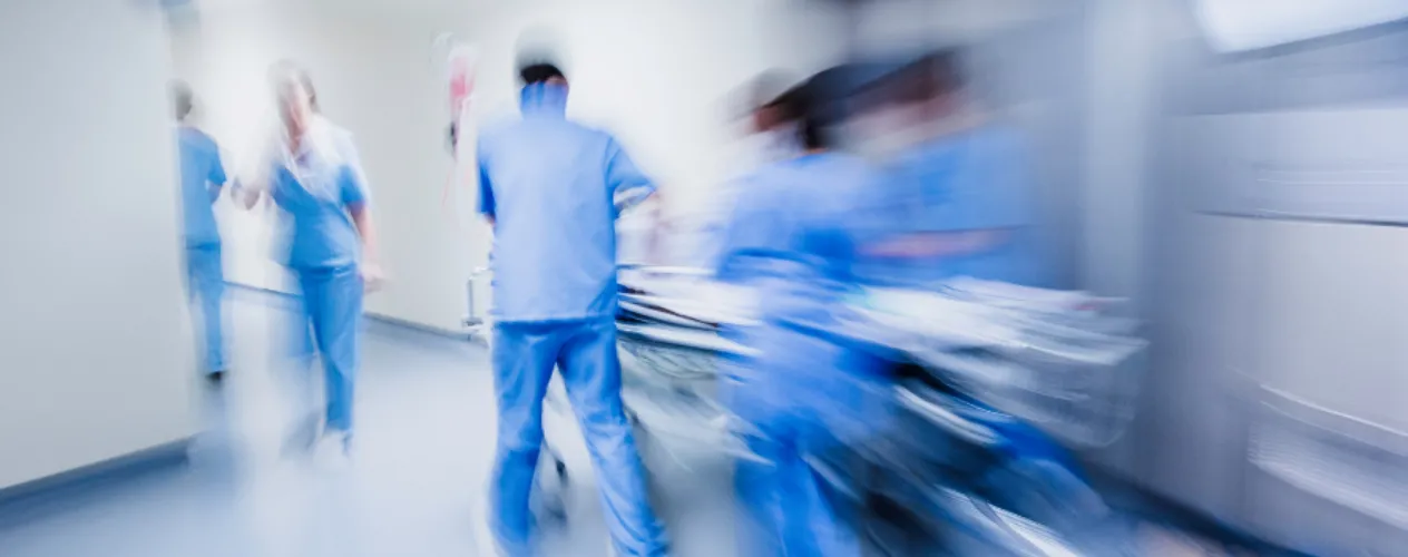 Emergency doctors rushing with operating bed