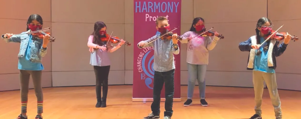 Young students playing violin