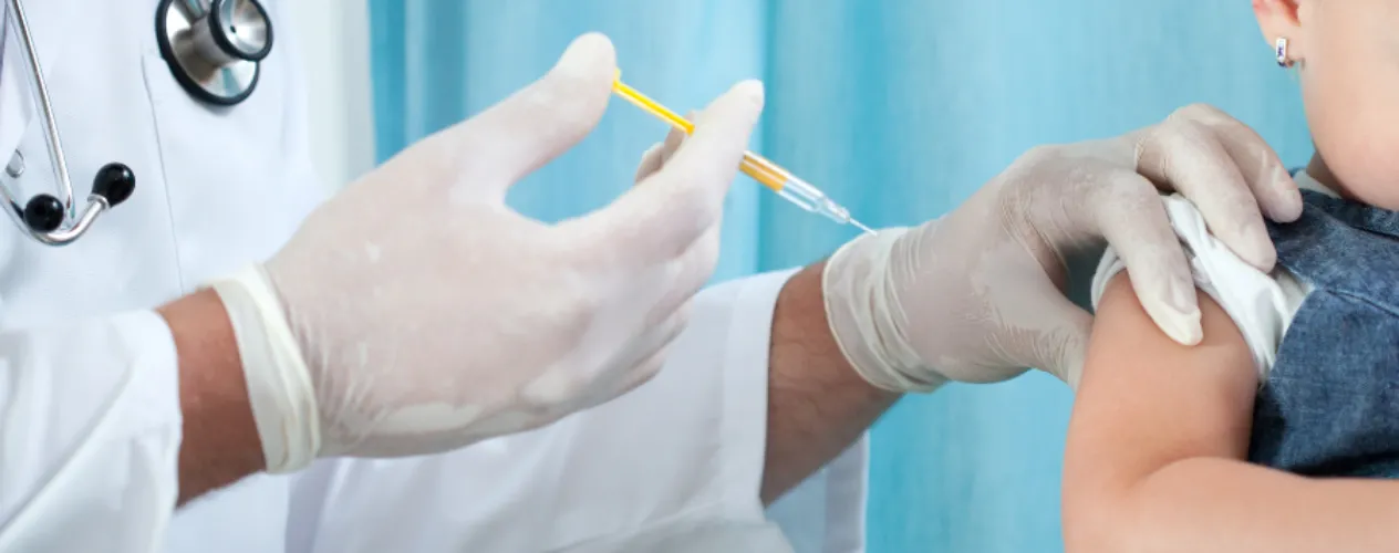 Doctor giving a vaccine to a child