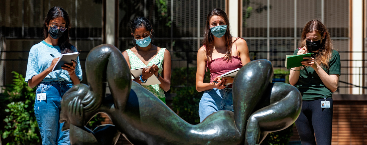 Students studying statue