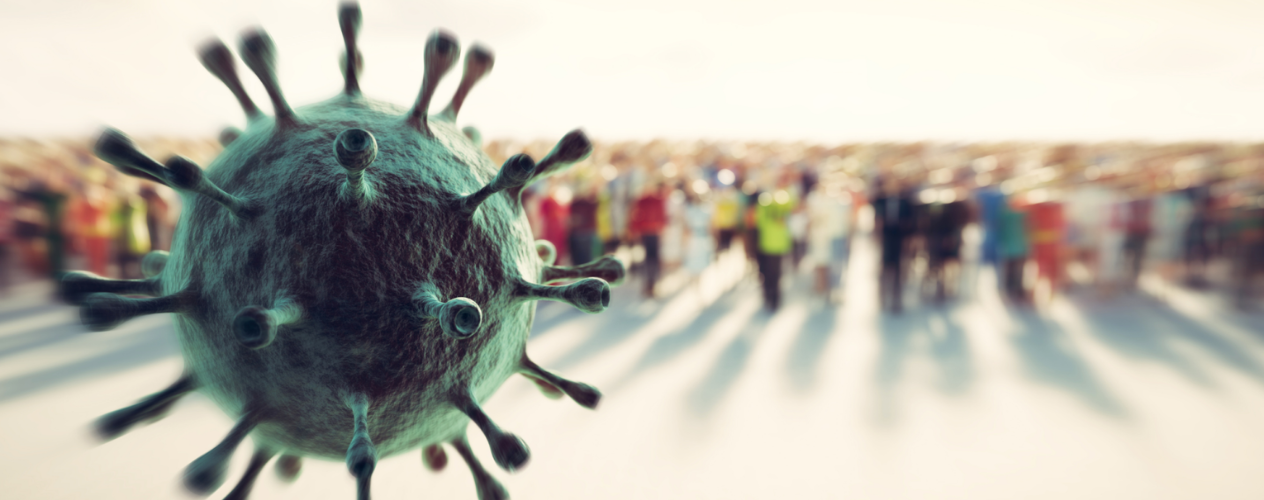 COVID-19 virus close-up with crowd of people in the background