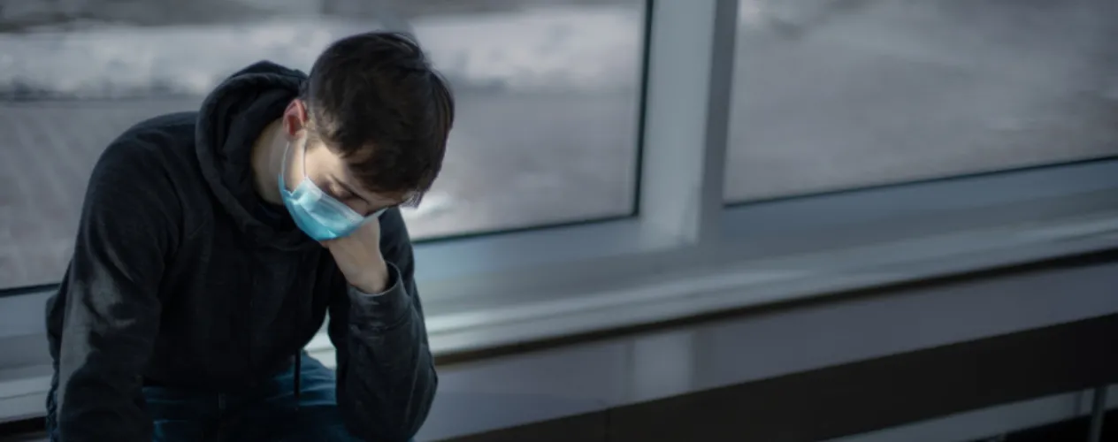 Teenager looking down