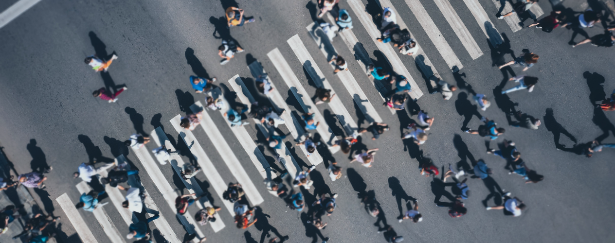 people walking across crosswalk