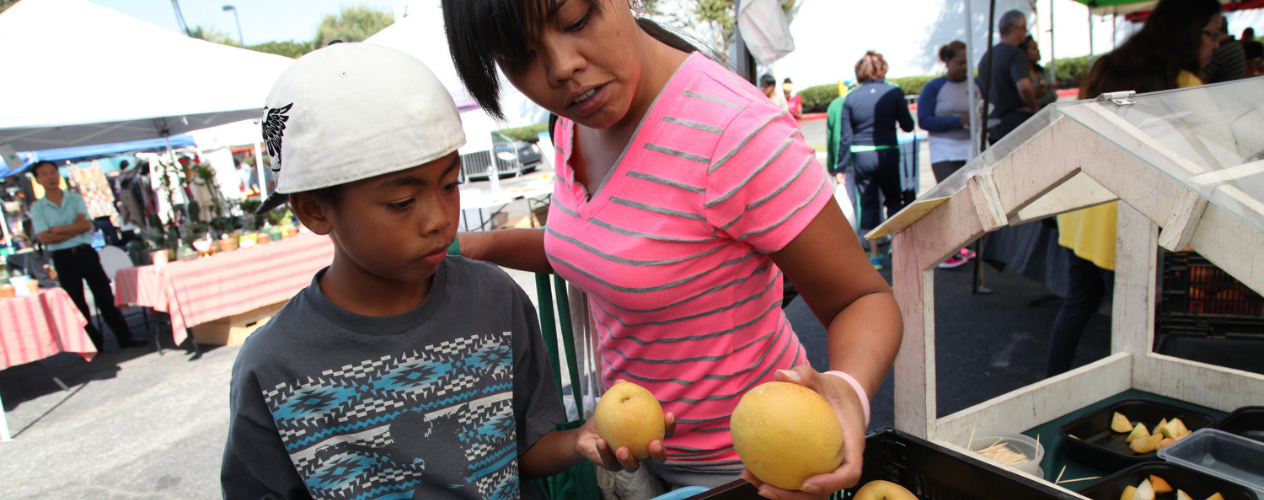 mother and son at farmers market