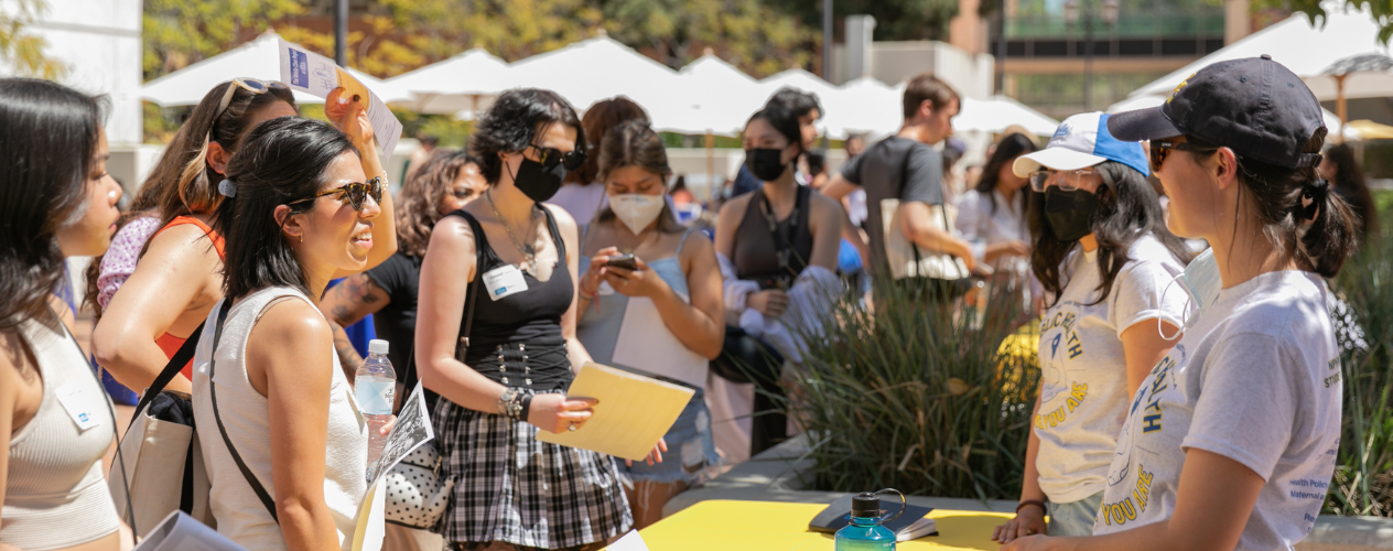 students checking in at event