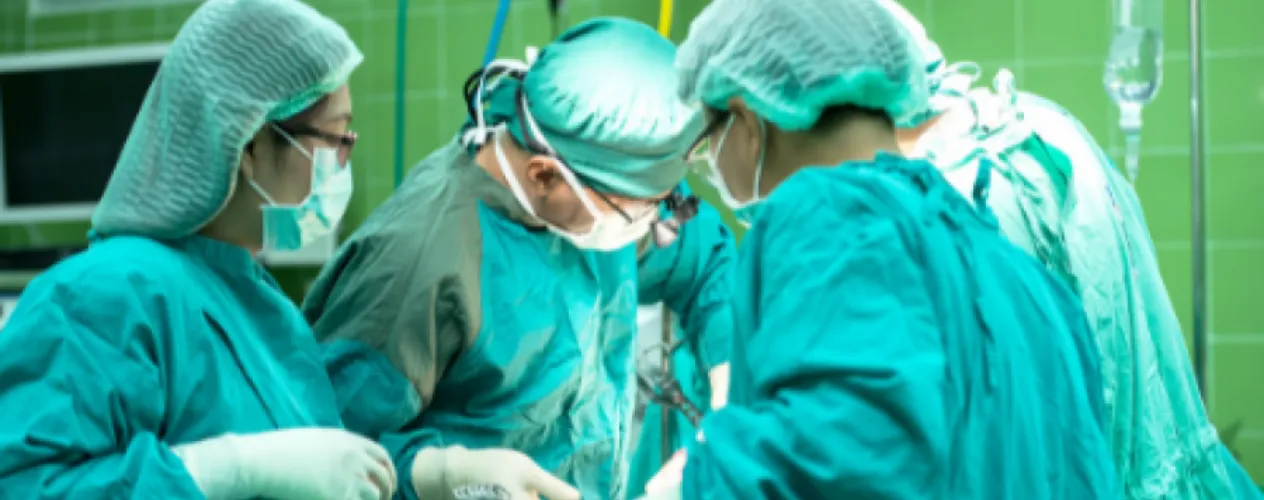Surgeons at operating table