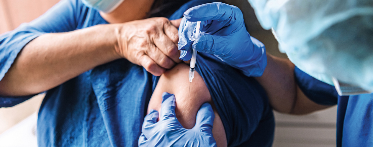 Individual receiving a vaccine shot