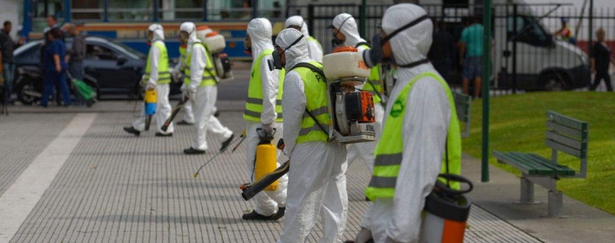 Men in disinfectant suits