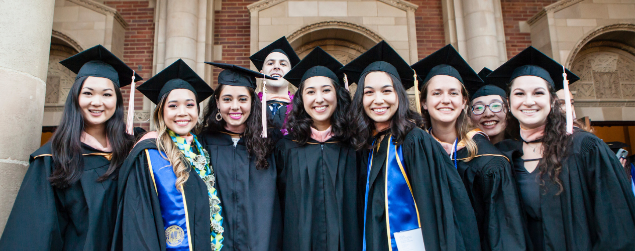 Graduates smiling standing together