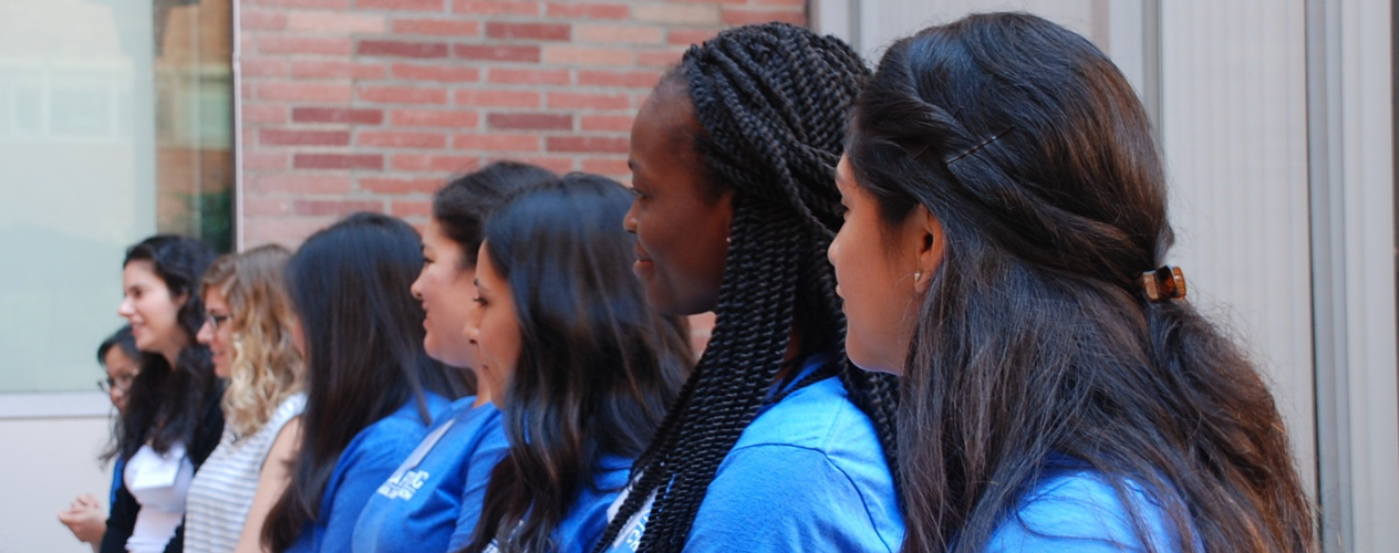 students standing outside next to one another