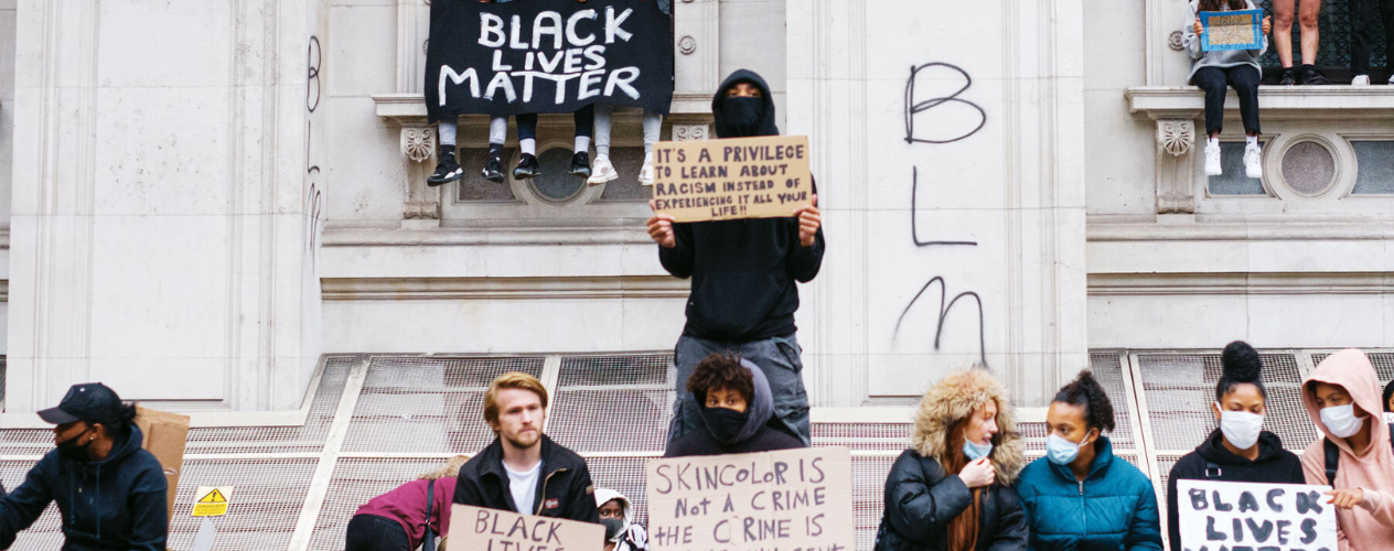 People holding BLM signs