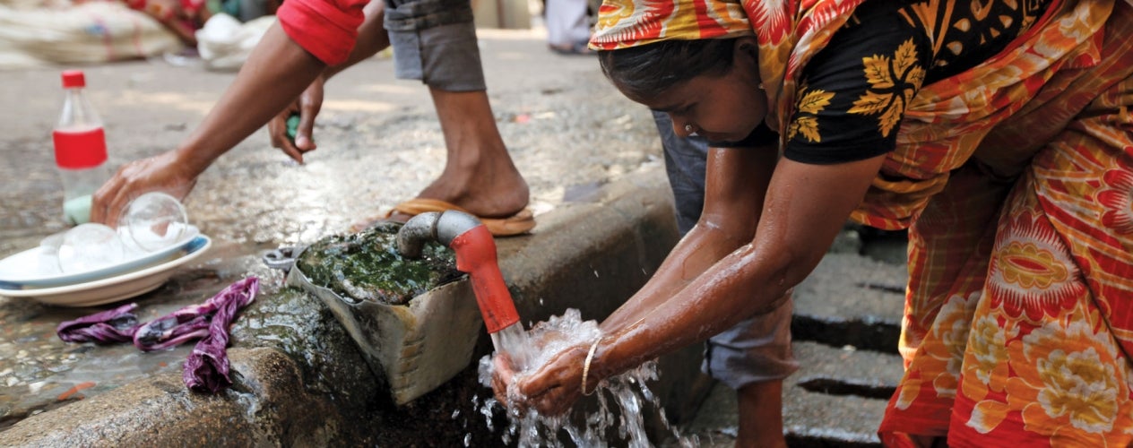 Woman in Bangladesh washing her hands