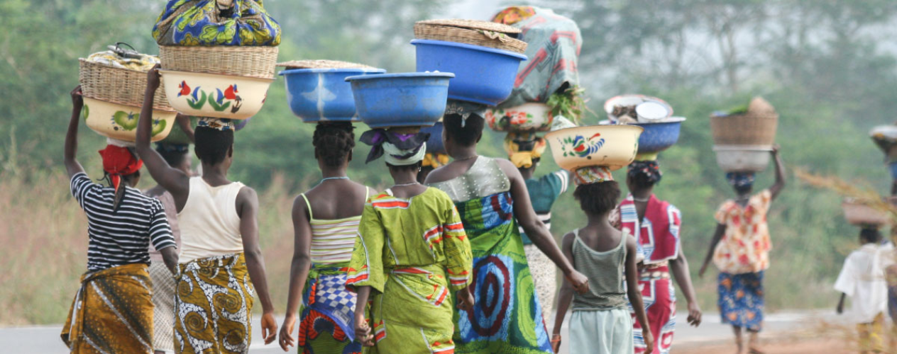 African women carrying bowls on their heads