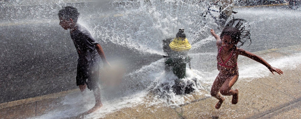 Kids playing in a fire extinguisher spray