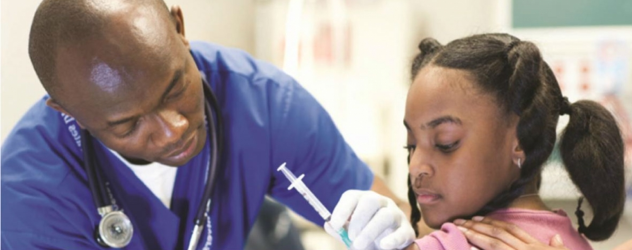 Doctor administering a vaccine to a young child