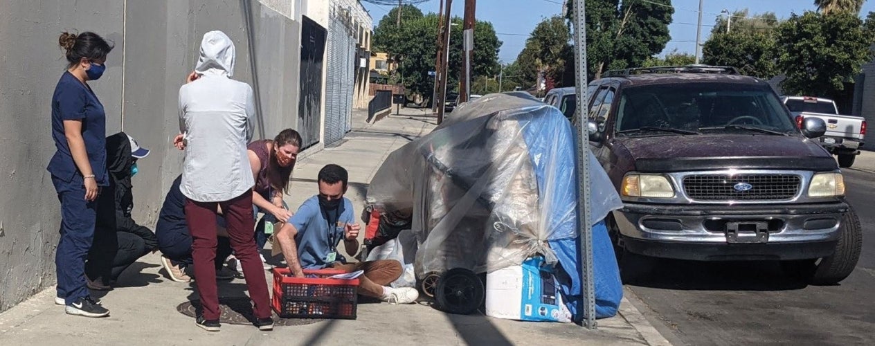 Housing for health staff members providing vaccine education and other essentials to people experiencing homelessness. 