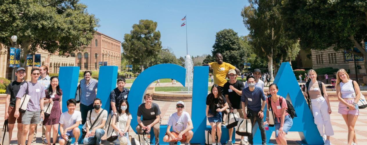 Students standing in front of a UCLA sign