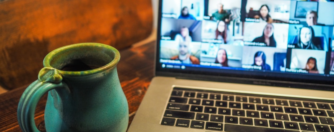 coffee mug and laptop virtual meeting
