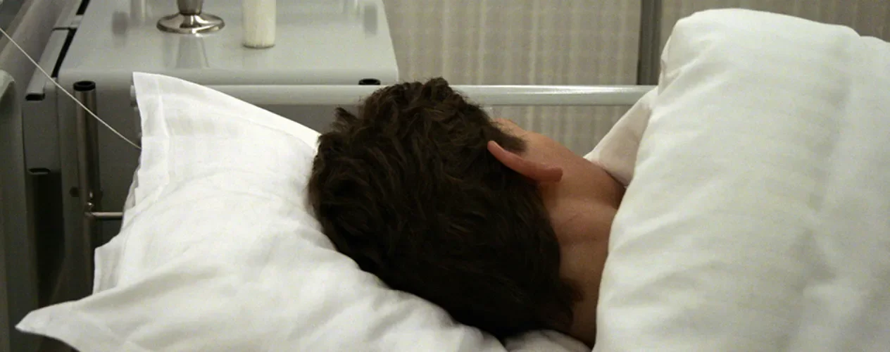 person in hospital bed