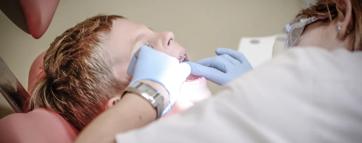 Child with dentist getting checkup