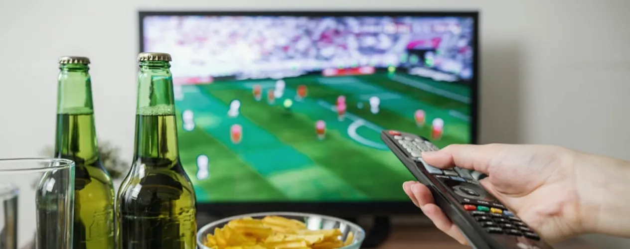 television, remote, and bowl of chips