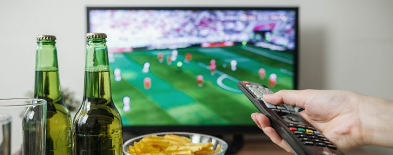 television, remote, and bowl of chips