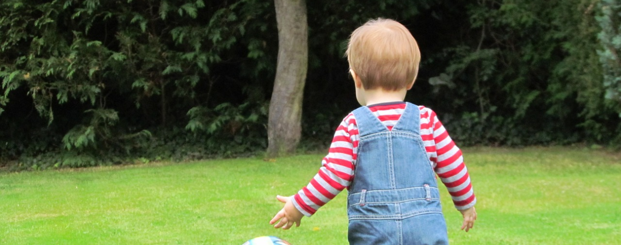 Child playing on grass