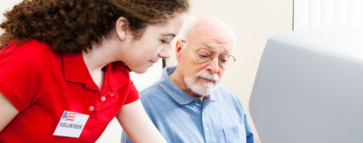 volunteer helping an elderly person