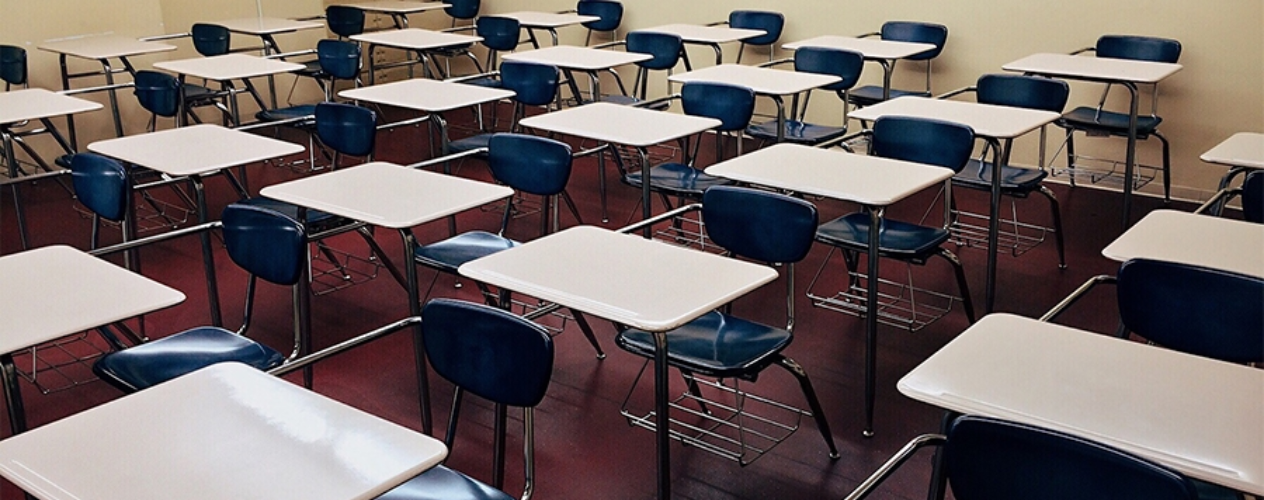 empty classroom with desks and chairs