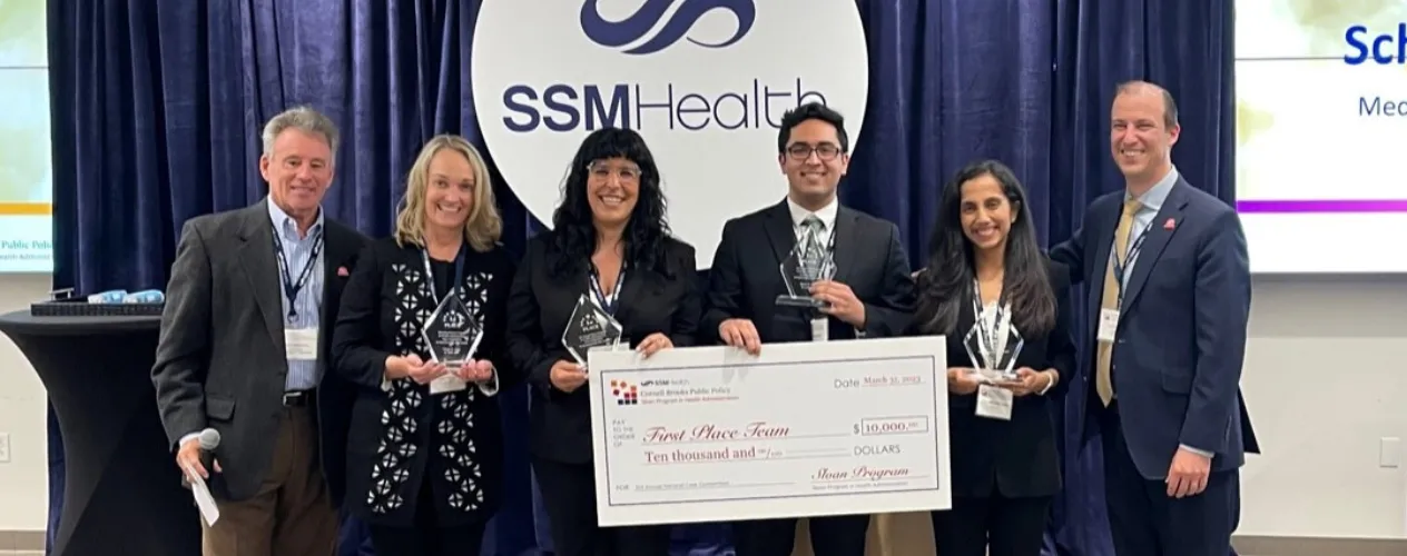 EMPH student team holding winning check