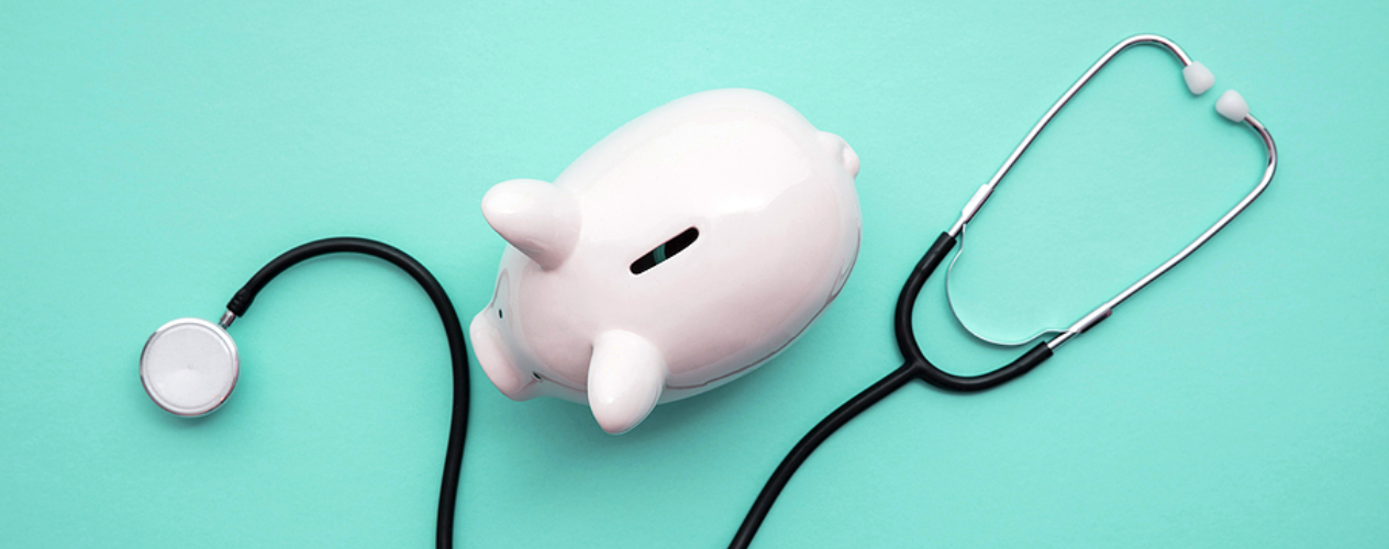 piggy bank and stethoscope