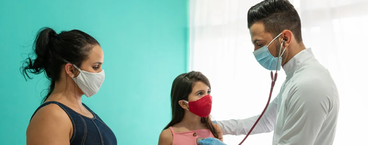 doctor listening to heartbeat of patient