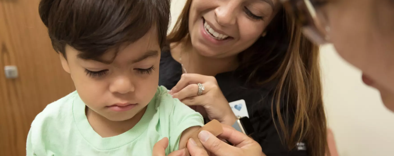 doctors bandaging a child