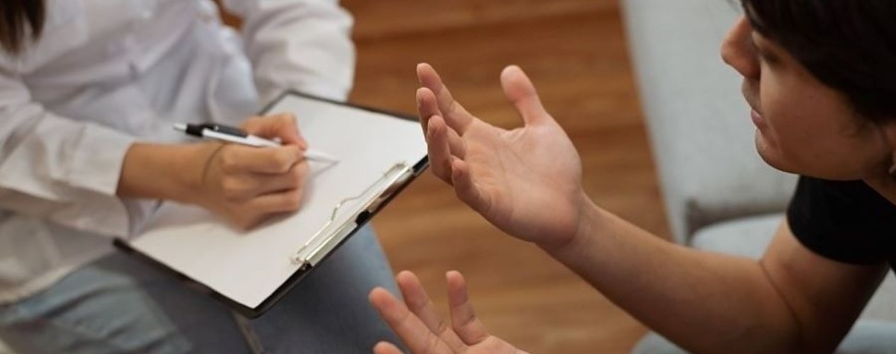 hands and a clipboard