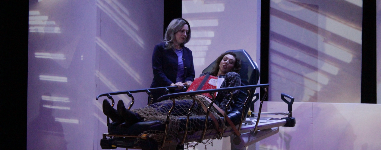 woman comforting person in hospital bed