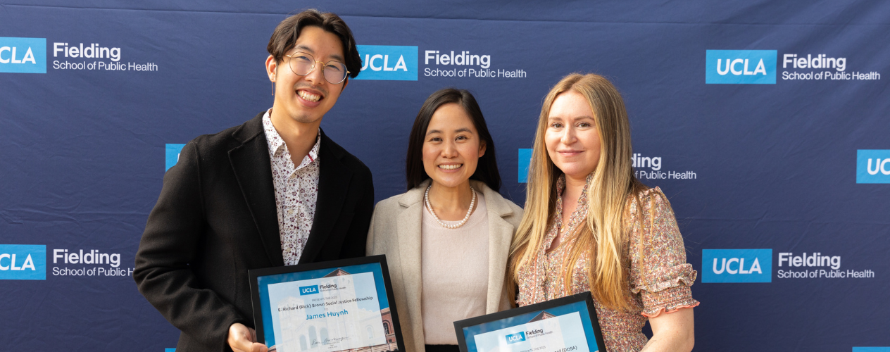 students and faculty member at awards ceremony