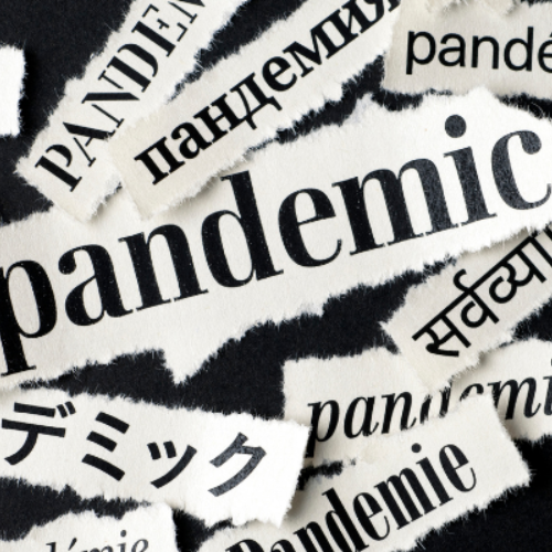 Pandemic written in different international languages on slips of paper