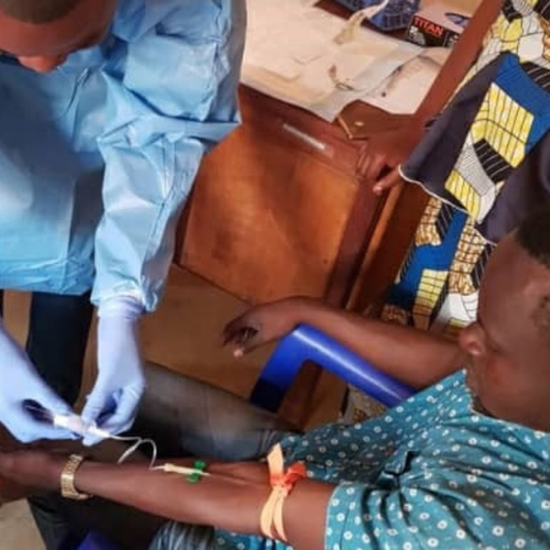 A team member from the Democratic Republic of Congo’s National Institute of Biomedical Research takes a blood sample from a vaccinated man in North Kivu Province.