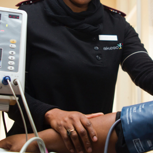 Doctor taking blood pressure of patient