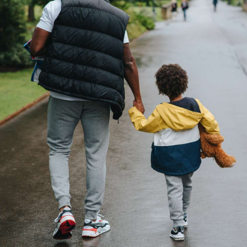 Child holding parent's hand