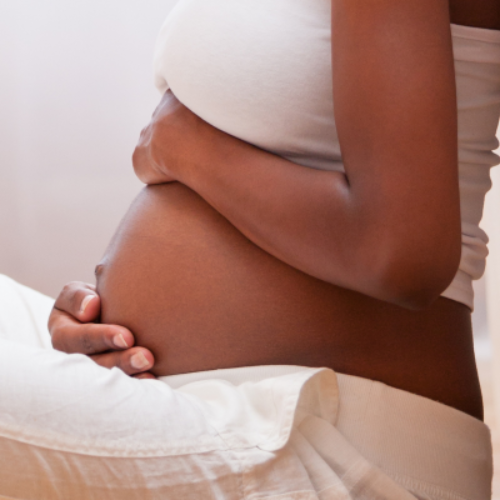 Pregnant woman holding stomach