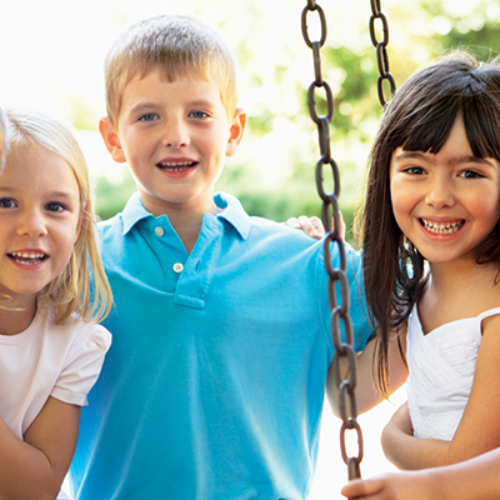 Young children on swingset