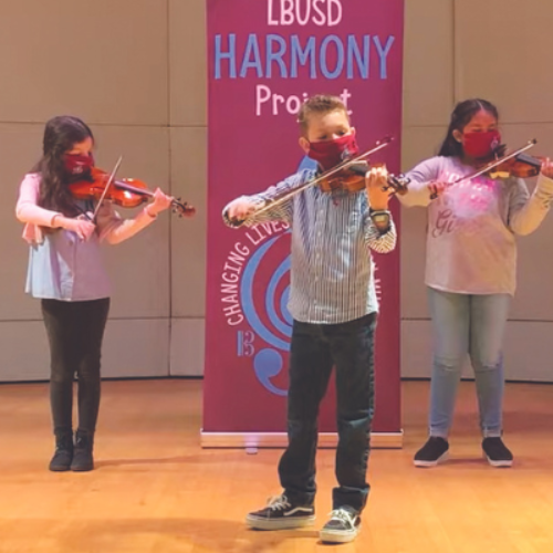 Young students playing violin